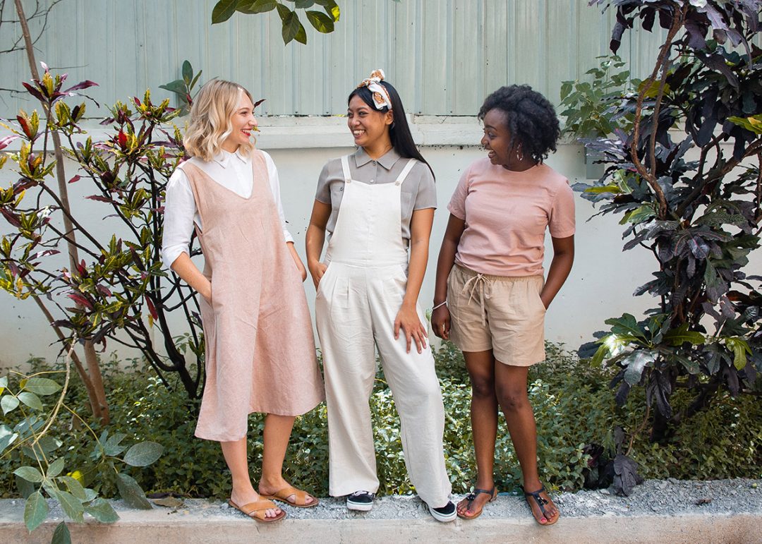 Three ladies wearing Morijana ethical clothing - dress, overalls and t-shirt